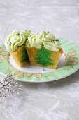 Vanilla Cupcake with a Green Tree Center and Green Frosting with Decorative Silver Balls; Halved