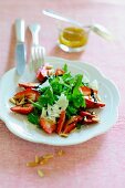 Rocket salad with strawberries, parmesan, balsamic vinegar and pine nuts