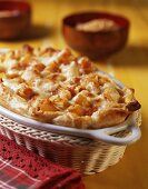 Pasta bake with sausage, béchamel and tomato sauce in puff pastry