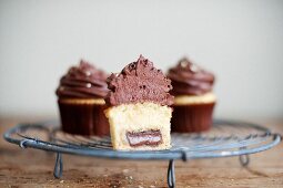 A cupcake cut in half to show the filling