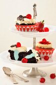 Cupcakes on a tiered cake stand: black forest and red velvet cupcakes