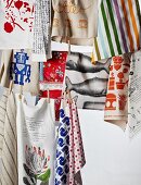 Colourful tea towels hanging on washing lines