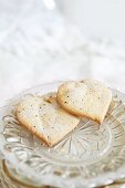 Two heart-shaped biscuits with vanilla sugar