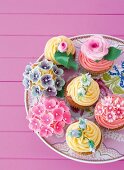 Flower cupcakes on a cake plate