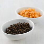 Black and red lentils in bowls