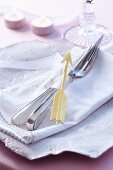 A napkin concept with a ribbon and Cupid's arrow
