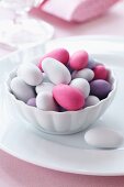 Colourful sugared almonds in a small bowl for a wedding