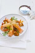 Fried scampi with Emmental, chanterelle mushrooms and vegetables (Christmassy)