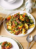 Grilled peach and pistachio salad with Prosciutto