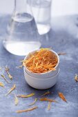 Dried marigold petals in a little bowl