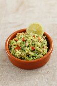 Classic Guacamole in a Glass Bowl; Fresh Avocados