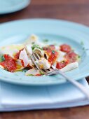 Fish ravioli with tomato sauce