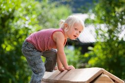 Germany, Girl playing on playground