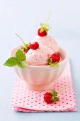 Bowl of wild strawberry ice cream, close up