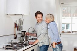 Couple cooking in kitchen together