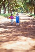 Two children playing on a path