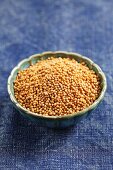 White mustard seeds in a small bowl