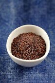 Black mustard seeds in a bowl