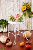 Organic Fruit and Vegetables; Halved Watermelon on a Chair