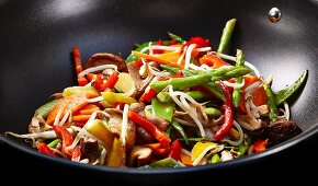 Beansprouts, peppers, shiitake mushrooms and asparagus in a wok