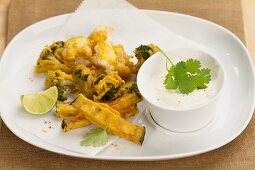 Pakoras (battered vegetables, India) with yoghurt dip