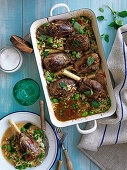Oregano braised lamb shanks with broad beans, peas and orzo