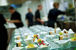 Waiters preparing a buffet of starters