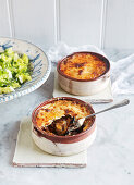 Summery moussaka with chickpeas on a light yellow background