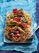 Noodles with pork and vegetables cooked in a wok (Vietnam)