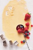 Shortcrust pastry with alphabet cutters and berries