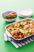 Pasta bake with dried tomatoes, cheese and croutons