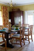 Dining table set with fruit and candlesticks