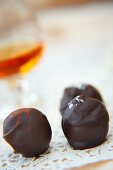 Three Assorted Truffles and a Snifter of Scotch
