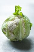 A whole cauliflower with leaves