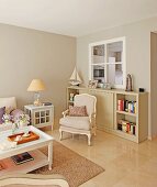 Antique armchair in front of sideboard in tasteful, country-house living room