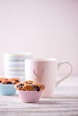 Blueberry muffins and cups of coffee