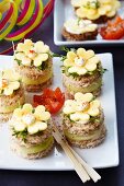 Canapes for New Year's Eve decorated with clover leaf-shaped cheese
