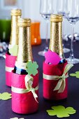 Piccolo bottles decorated with tissue paper and tags