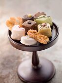 Assorted biscuits and petits fours on a cake stand