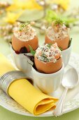 Assorted filled eggshells: with celery and walnuts, with carrots and horseradish, and with salmon