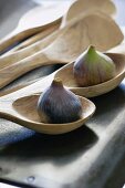 Fresh figs on wooden spoons