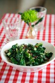 Cooked chard with pine nuts and raisins