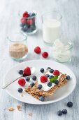 Crisp breads with fresh berries and crème fraiche