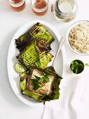 Barbecued fish wrapped in banana leaves