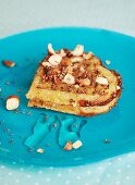 A heart-shaped waffle with hazelnuts, honey and chocolate