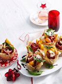 Puff pastry baskets filled with peaches, ham and mozzarella