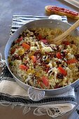 Couscous with olive oil, onions, tomatoes and raisins (Tunisia)