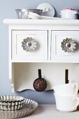 Small cake moulds used as furniture knobs