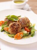 Veal meatballs with asparagus, carrots and tomatoes