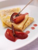Pancakes with stewed plums